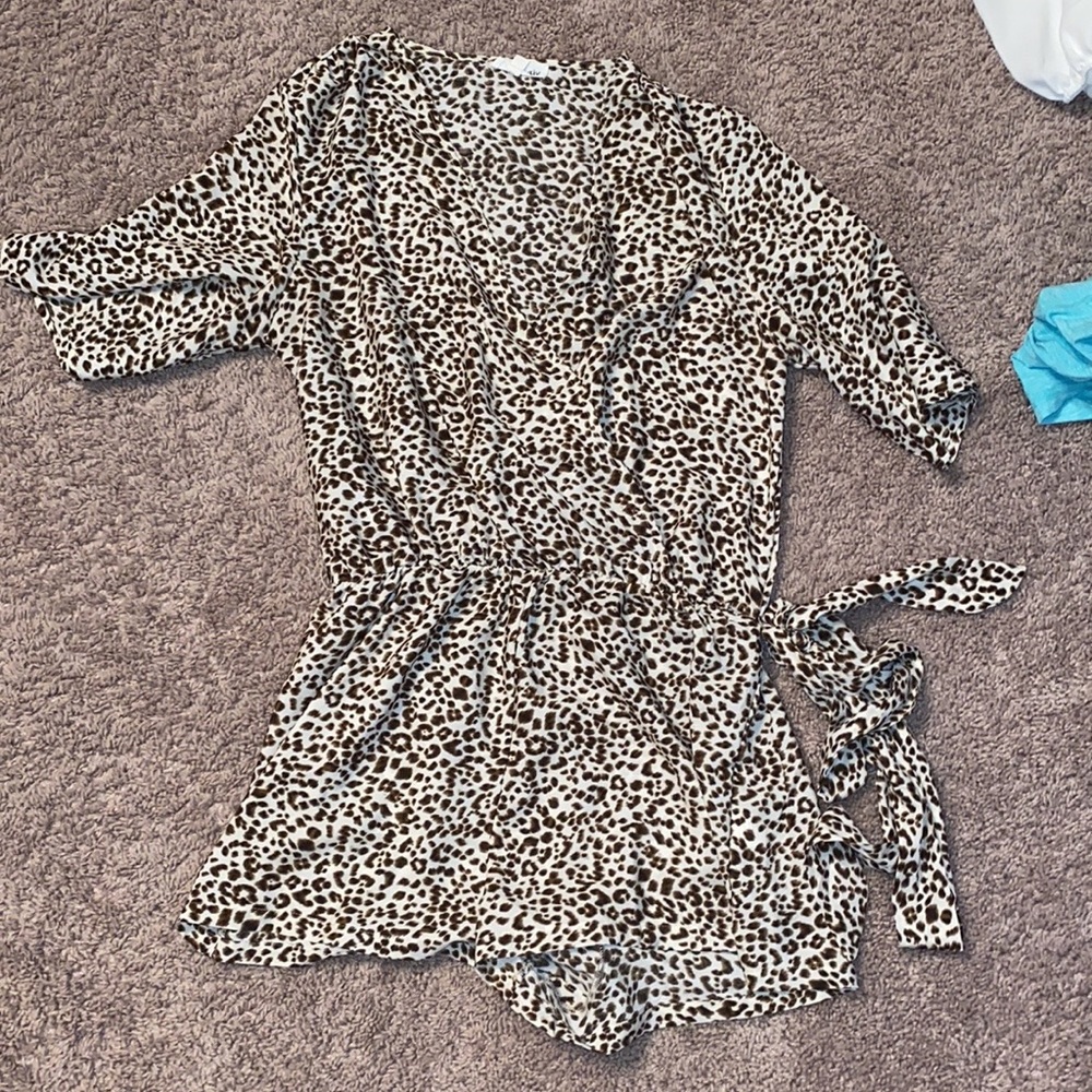 Cheetah romper, size large.